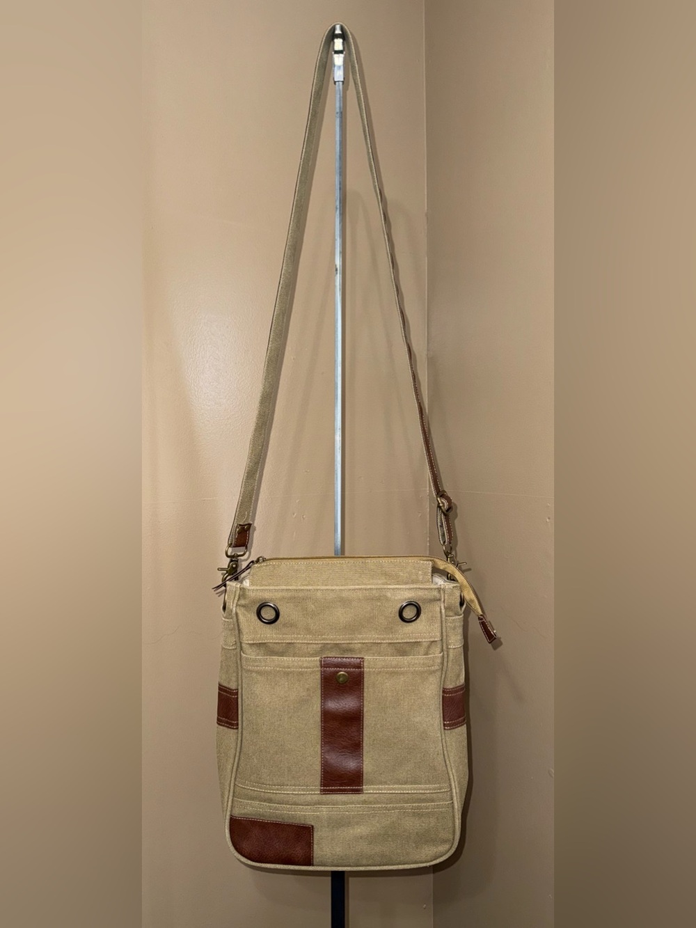 Canvas Crossbody Messenger Bag in Beige with Brown Accents.